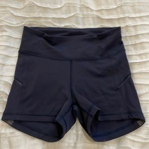 Lululemon shorts. Navy blue. As pictured. Back zipper pocket.